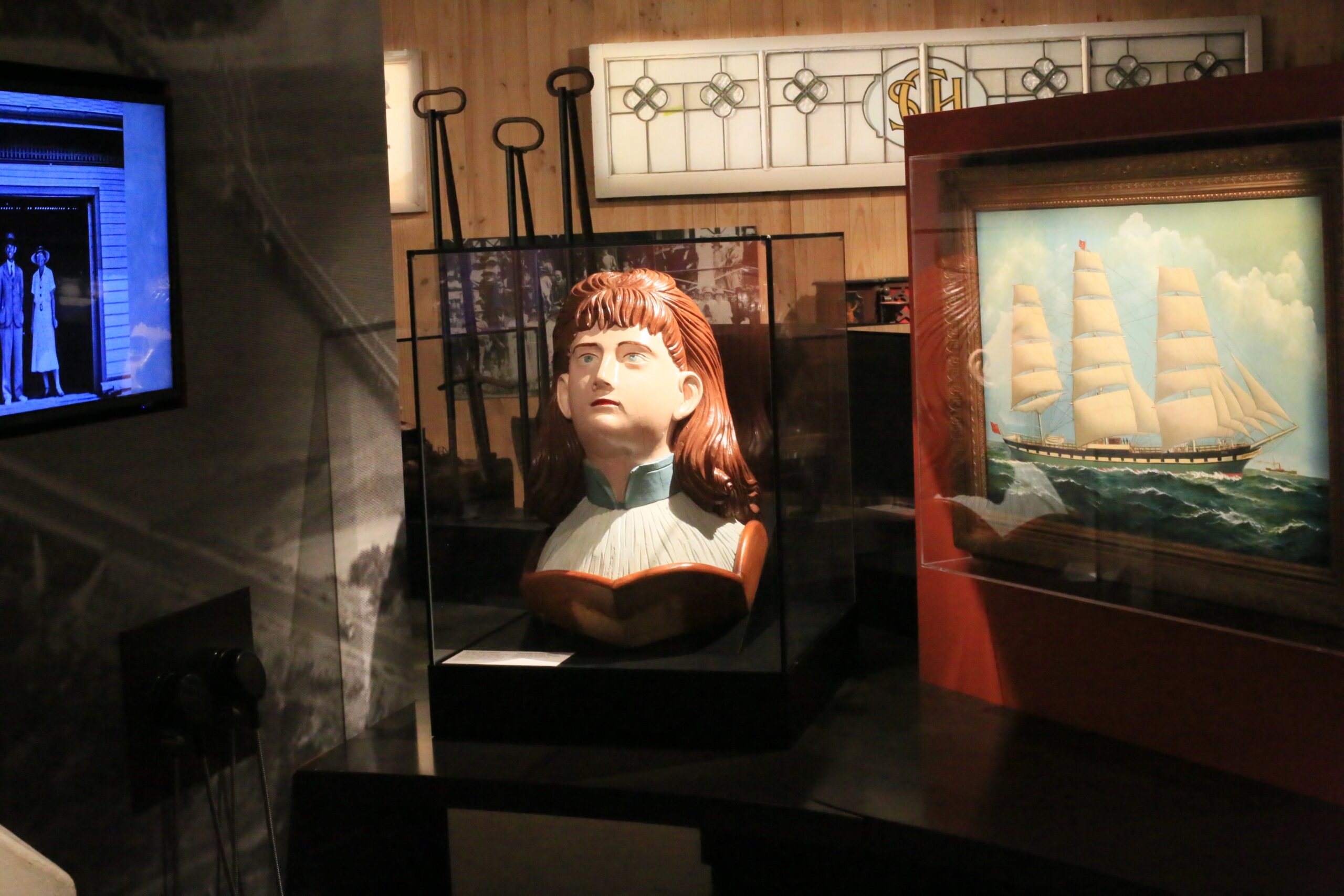 Artifacts salvaged from the 1906 shipwreck of The Speke including the ship's restored figurehead.